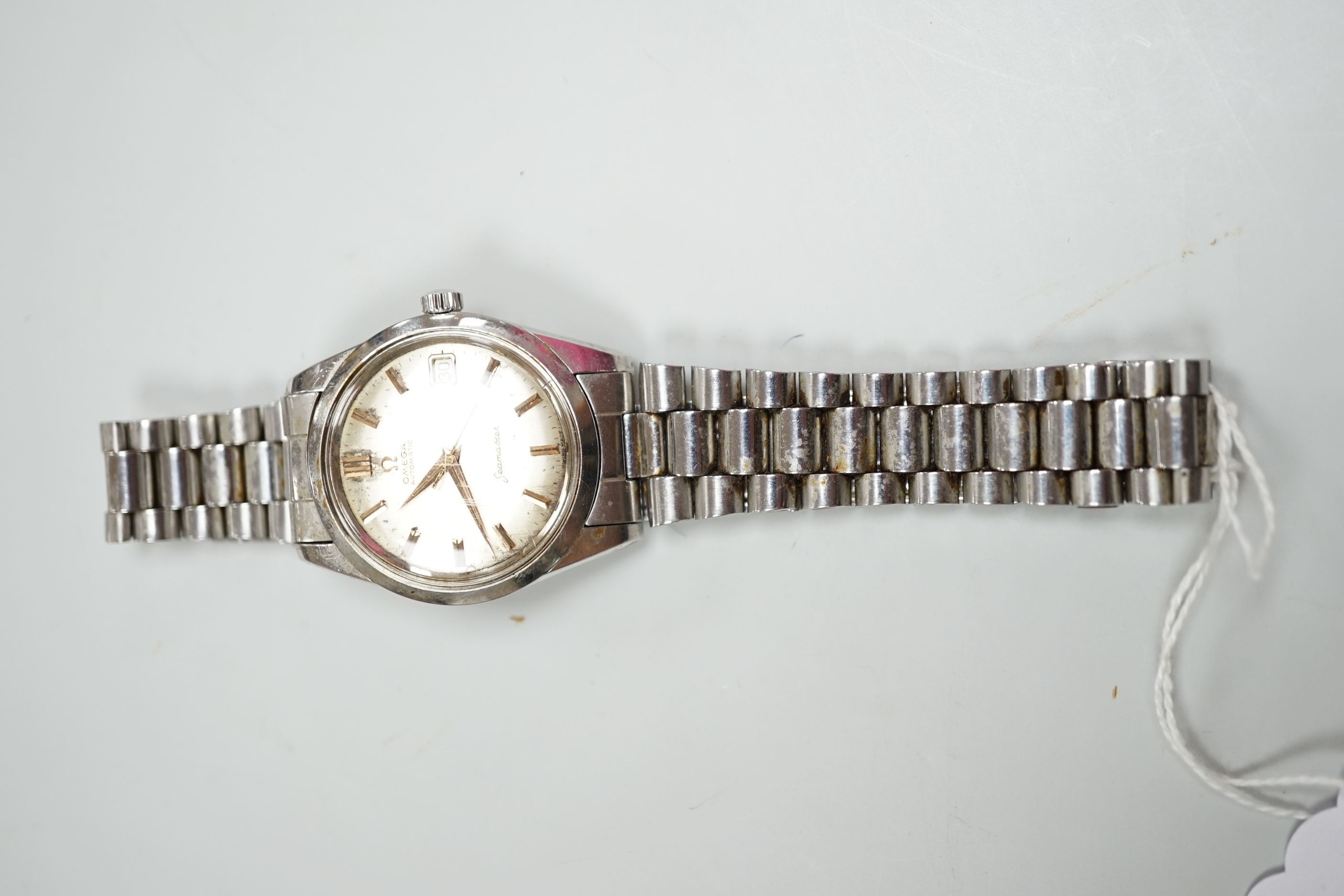 A gentleman's steel Omega Automatic Seamaster wrist watch, with baton numerals, centre seconds and date aperture, diameter 3.5cm